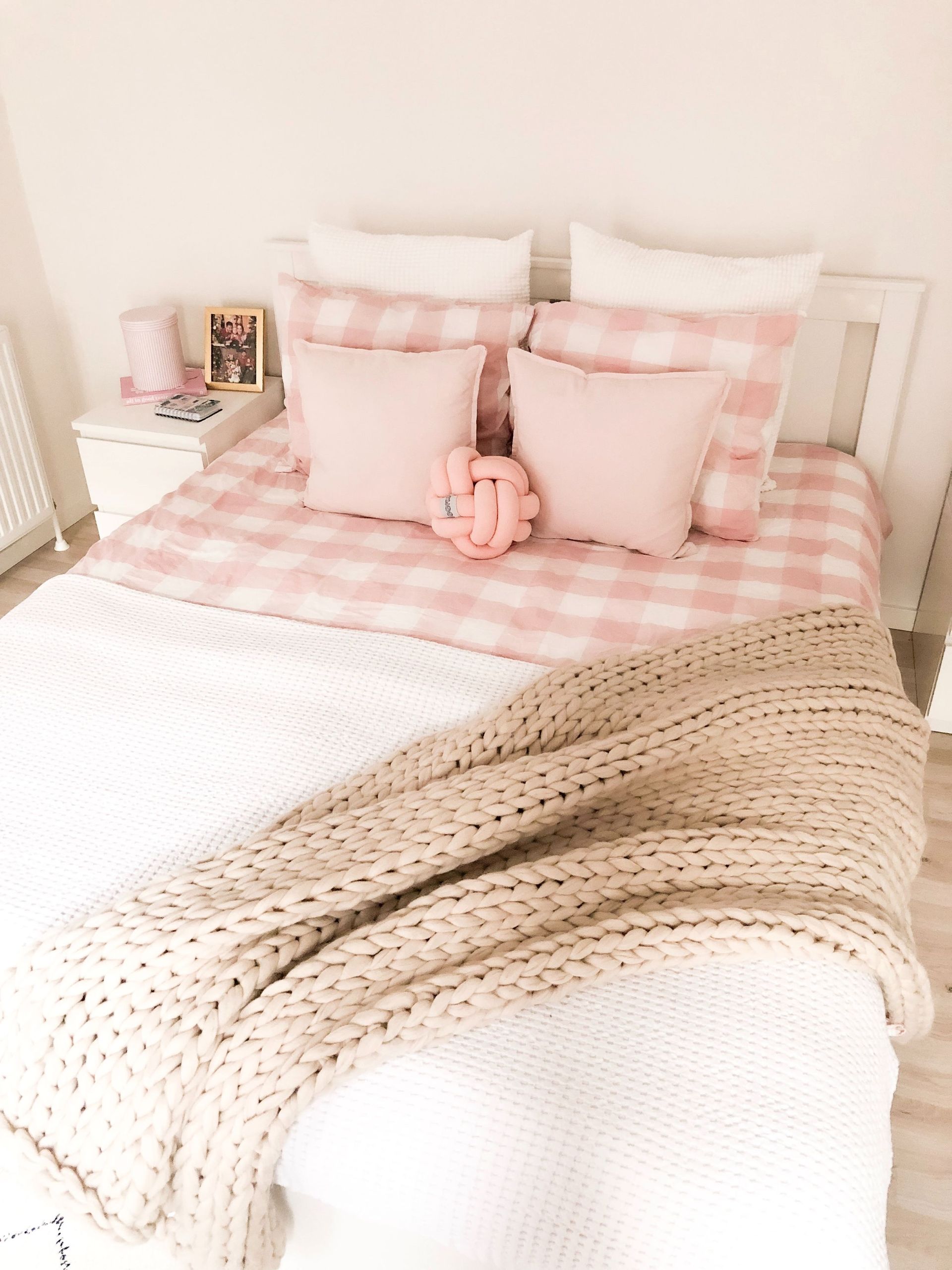 Bed with white and pink comforter